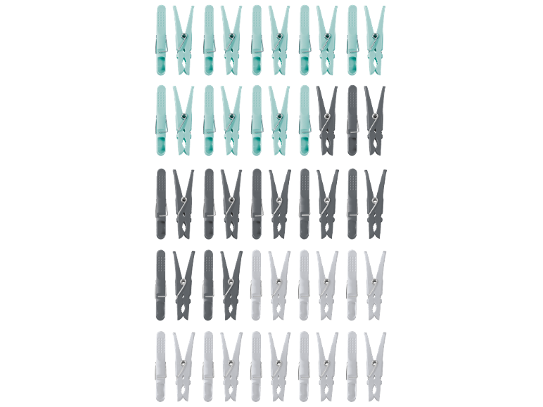 Plastic clothes pegs in blue, grey, and white tones.