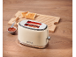 Beige toaster with toast and jam on a wooden table, inscription '1973'.