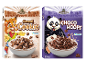 Two cereal boxes with animal characters, one with cookies and one with chocolate hoops.
