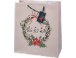 Christmas gift bag featuring a festive wreath, poinsettias, and the text 'ho ho ho'.