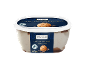 Coffee flavoured ice cream in a tub with coffee beans and a scoop of ice cream.