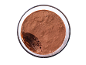 Chocolate mousse in a glass bowl with a missing scoop, top view.