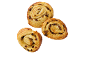 Three golden, rolled raisin swirls on a black background.