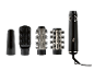 Black hairdryer with interchangeable brushes for styling and drying.