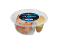 Cooked prawns with jerk dip in a plastic container, Latin American style.