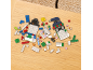 Colorful building blocks scattered on a wooden table, including snowman figures.