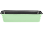 Light green loaf pan with a black interior.