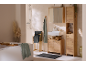 Bathroom with wooden furniture, sink, bathtub, and shower.