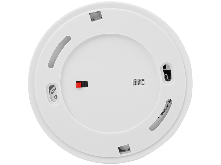 Underside of a white smoke detector with a red test button and inscriptions.
