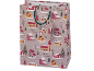 Christmas gift bag with a snowy village motif and 'Merry Christmas' inscription.