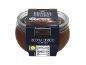 Chocolate ricotta dessert in a glass jar with nutritional information.