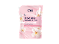 Pink liquid soap pouch with almond blossoms and text.