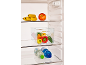 Open refrigerator with bananas, an apple, peppers in a container, and water bottles.