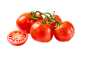 Fresh red tomatoes on the vine, one sliced in half, with water droplets.