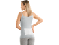 Woman with a pain relief patch on her lower back