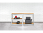 Metal shelving units with wooden boards, holding tools, shoes, and storage boxes.