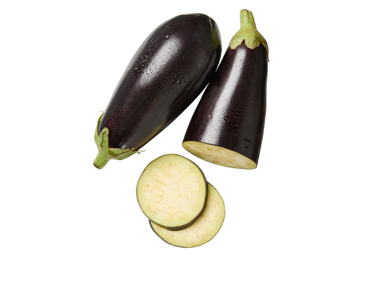 Fresh eggplants, one cut in half and two slices, on a black background.