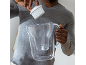 Man inserting a water filter into a clear pitcher.