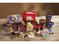 Variety of ice creams in tubs and cups, including high protein and classic flavors, with cones and fruit.