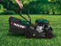 Person mowing lawn with a lawnmower with a grass collector.