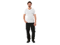 Man in white t-shirt and black work trousers with safety boots.