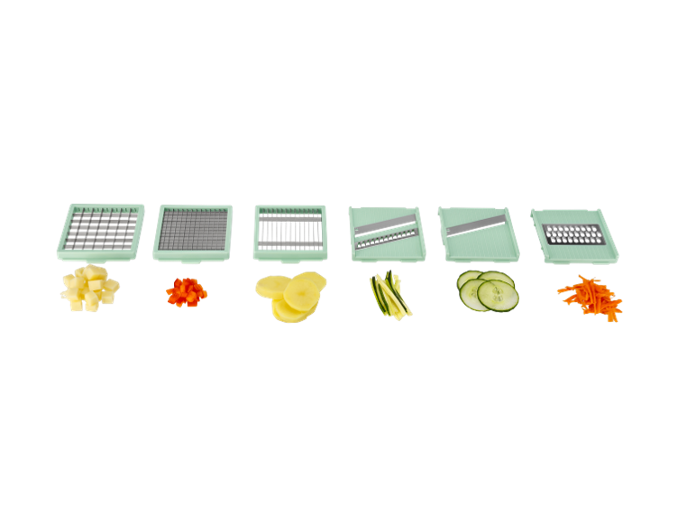 Vegetable slicer and grater set with various inserts and cut vegetables.