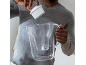 Man inserting a water filter into a clear pitcher.