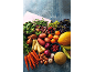 Assortment of fresh fruits and vegetables, including carrots, potatoes, green beans, and melons.