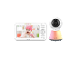 Baby monitor with a screen showing a baby and a camera unit with a night light.