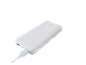 White power bank with a charging cable plugged in.
