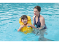 Girl in yellow life vest and woman in blue swimsuit in pool