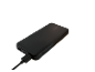 Black power bank with a charging cable plugged in.