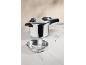 Metal pressure cooker with lid, black handle, and steaming accessories.
