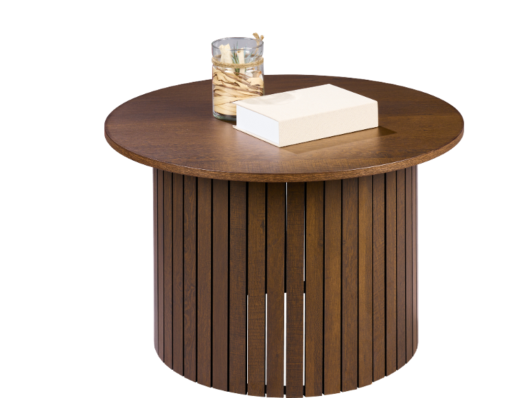 Round wooden coffee table with a vase and a book.