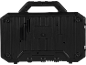 Back of a black portable speaker with a handle and textured details.