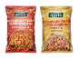 Two packs of cashew and peanut mix: one with chili and one with honey and salt.