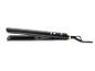 Black hair straightener with gold buttons and 'BEAUTY' text.