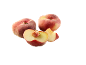 Two whole and two cut flat peaches on a black background.