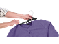 Hands hanging a purple cardigan on a black hanger.