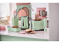 Mint green kitchenware: kettle, toaster, bread pan, and knife set.