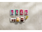 Four packs of ready-to-roll icing in various colors, with bunny-themed cupcakes on a tray.