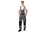 Man in grey work overalls and white t-shirt
