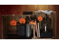 Halloween decorations with pumpkin cutouts and a black cat cutout with 'BOO' text.