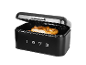 Black bread bin with open lid, a pretzel inside, displaying «1973».