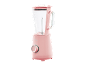 Pink blender with a glass jug featuring measurements and a control knob.
