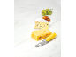 Cheese board with two types of cheese, crackers, grapes, and a cheese knife.