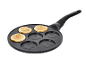 Pancake pan with smiling faces and three cooked pancakes