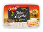 Dulce de Leche ice cream in 500g packaging, with caramel sauce and old town background.