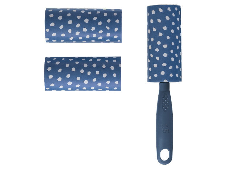 Lint roller and two refill rolls with a blue polka dot pattern.