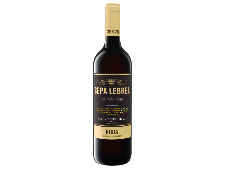 Bottle of red wine Gran Reserva Rioja with a gold and black label.